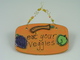 The veggies are small tiles fired onto the base in the final firing...